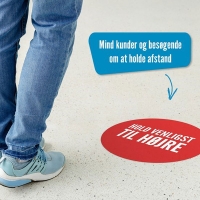 Gulvafmærkning Ø20cm med tekst "Hold venligst til højre"